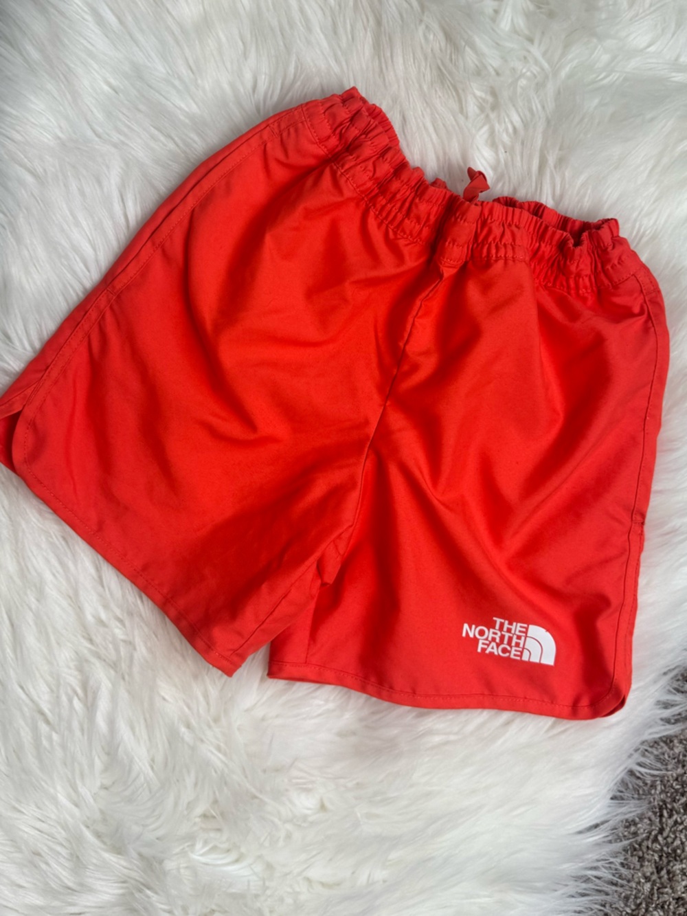 The North Face boys orange swim trunks shorts